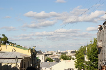 Fototapeta na wymiar Cityscape, small houses under the blue sky