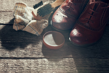 Pair of elegant shoes with polish cream