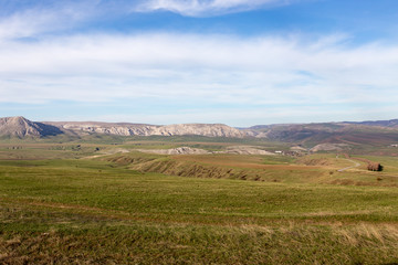 Fototapeta na wymiar Steppes and mountains in Kazakhstan as a background