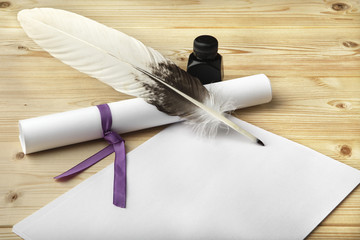 A clean of blank paper, a scroll, a goose feather, and a black ink bottle are located on a wooden...