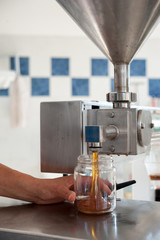 the filling of honey jars is the last step of honey processing