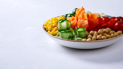  Buddha Bowl Vegetarian on a white Background. Raw Vegetables and  in chickpeas  a one bowl.Food or Healthy Diet concept.Super Food.Copy space for Text. selective focus.