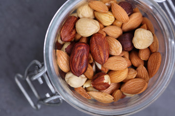 Mixed nuts on in a bowl : almond, cashew, peanuts, hazelnuts. Nutrition, healthy eating concept