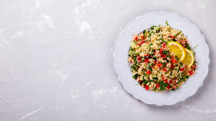 Tabbouleh salad with couscous on the plate.Traditional middle eastern or arab...