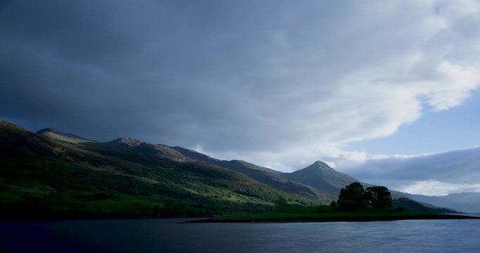 timelapse of clouds moving over loch leven near kinlochleven and the pap of glencoe on a summer evening in scotland