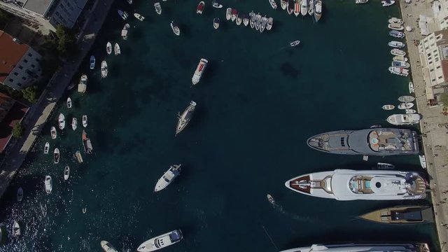 Aerial overview port of island Hvar in Croatia. A lot of boats and yachts small and big in marina, top view. 4K