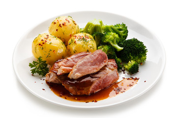 Grilled beefsteak with broccoli and carrot on white background 