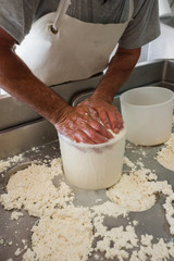 Shepherds prepare ricotta cheese with fresh sheep's milk