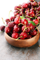 Cherry bowl with sweet cherries with leaf