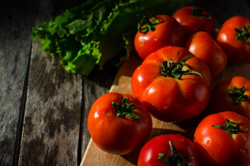 Ripe tomatoes on a cutting Board