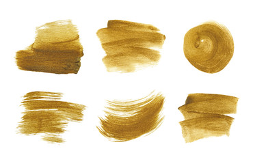 Gold metallic brush stroke set. Isolated hand drawn vector brushes. Gold glitter texture.