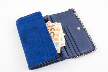 Blue wallet close up with money isolated on white background.
