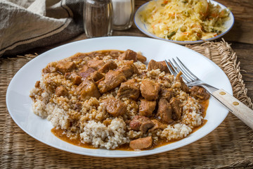 Barley groats with stewed meat.