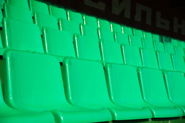 Empty green seats in stadium