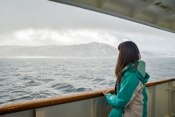 Girl on the balcony of a ship