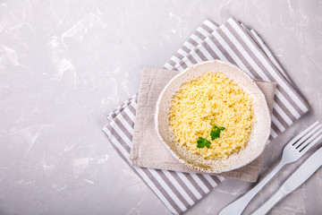 Couscous with parsley in the bowl..Concept of Healthy Food.Food or Healthy diet concept.Super Food.Vegetarian.Copy space for Text.