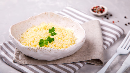 Couscous with parsley in the bowl..Concept of Healthy Food.Food or Healthy diet concept.Super Food.Vegetarian.Copy space for Text.