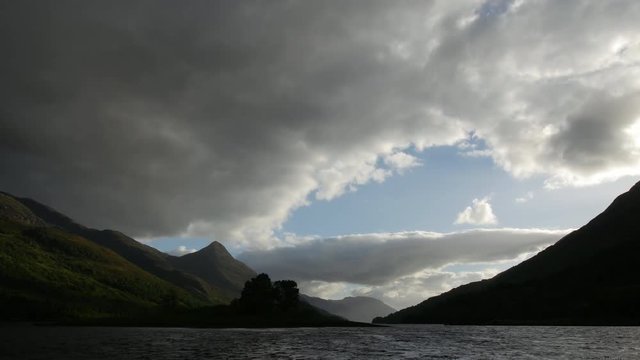 timelapse of clouds moving over loch leven and the pap of glencoe in scotland on a summer day