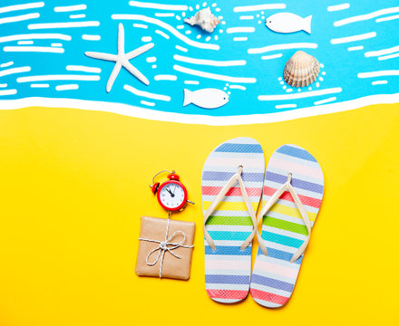 Summertime flip-flops and alarm clock with gift