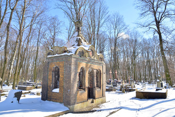 Old stone crypt in cemetery.