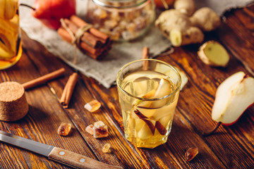 Glass of Water Infused with Pear, Cinnamon and Ginger.