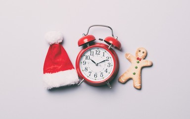 Red alarm clock and gingerbread man
