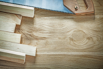 Composition of handsaw wooden planks on wood board construction 