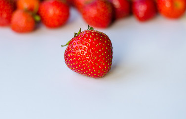 Summerwarm strawberries on white background