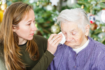 Elderly woman and young carer