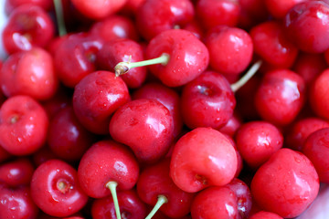 Healthy, juicy, fresh, organic cherries in fruit bowl close up. Cherries in background.