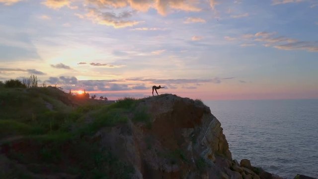 Flexible health girl practice yoga meditate sunrise coast namaste drone footage
