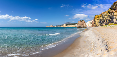 Firiplaka Beach with silver sand and huge colored rocks forming its coastline. South shore of the island of Milos. Cyclades Islands, Greece.
