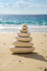Fototapeta na wymiar Stacked tower of balancing smooth pebbles.