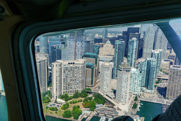 Fototapeta na wymiar Aerial view at day of Toronto, Ontario, Canada through aeroplane window.