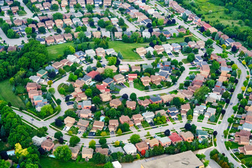 Aerial view of houses in residential suburb, Toronto, Ontario, Canada. © bruno135_406