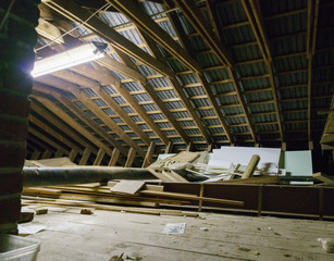 Various pieces of cut wood being stored in loft space.