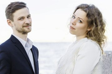 Happy newlyweds look at the camera