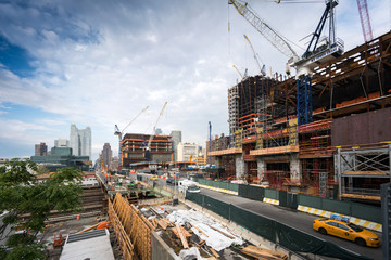 Fototapeta na wymiar Construction site with incomplete buildings and cranes, New York, USA.