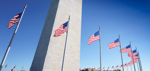 Close up of Washington obelisk encircled with flags, Washington DC, USA, United States of America.