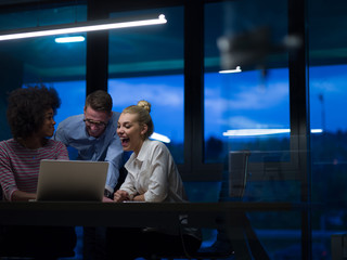 Multiethnic startup business team in night office