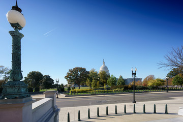The Capitol building dome seen in the distance with lamp post in foreground, Washington DC, USA.
