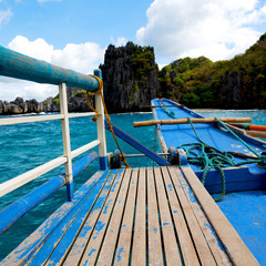 view of the island hill from the prow of a boat