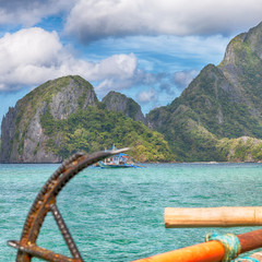 view of the island hill from the prow of a boat