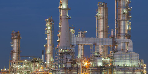 refinery plant exterior structure against dusky blue sky