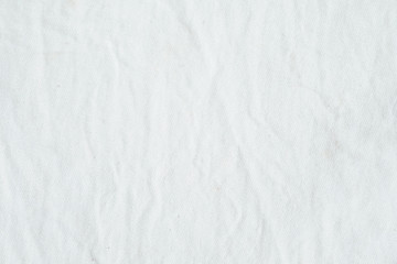 Naklejka na ściany i meble Wrinkled white cotton fabric texture background, wallpaper 
