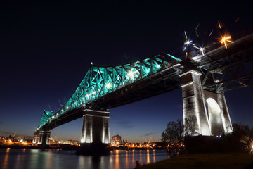Jacques Cartier Bridge Illumination in Montreal, reflection in water. Montreal’s 375th...