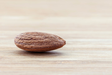 almond seed on vintage wooden table