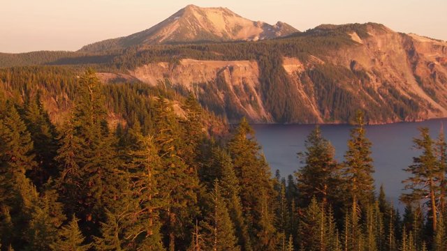 Oregon Aerial v15 Flying low over Crater Lake area at sunset