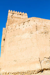 in oman    muscat    the   old defensive  fort battlesment sky and  star brick