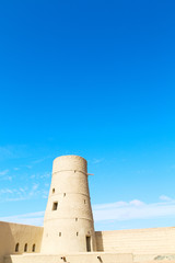 in oman    muscat    the   old defensive  fort battlesment sky and  star brick